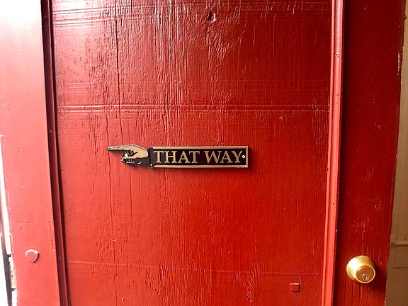Door facing stoop. Three steps to enter.