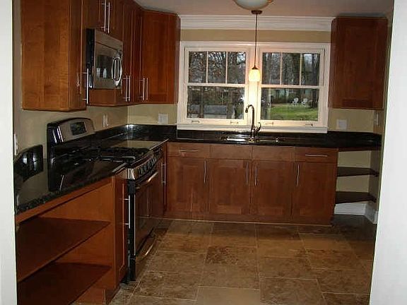 New Kitche w/granite, SS and travertine tile floors