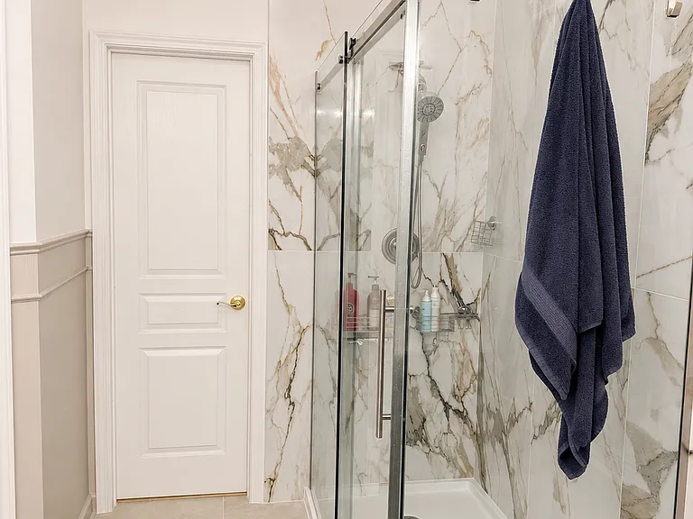 Master bath, door leads to walk in closet.