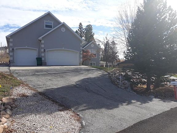 Front of house. Private garage on left side comes with unit
