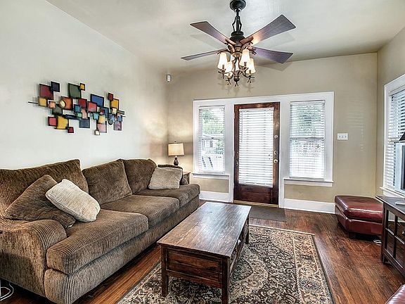 Front living room. Hardwood floors are carries through the entire home.