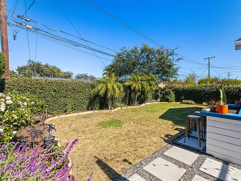 Backyard with fruit trees and garden area
