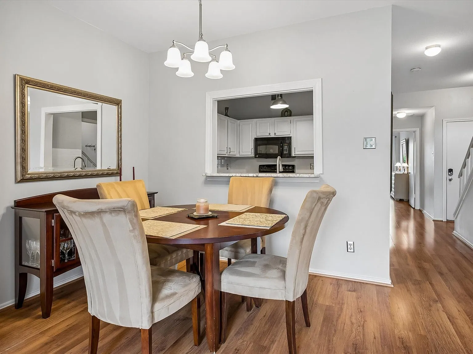 Large closet under stairs & laundry room down hallway off kitchen