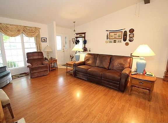 Vaulted Great Room with laminate flooring.