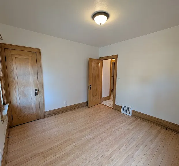 Additional view from second bedroom facing door to hallway