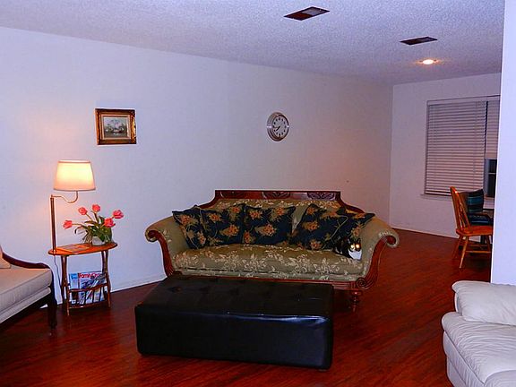 Formal living with laminate flooring into formal dining