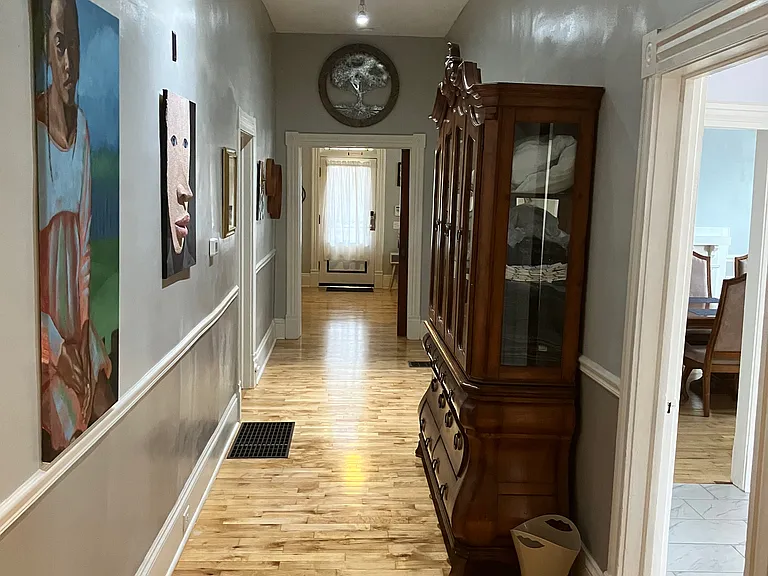 Hallway: view from rear to front door.