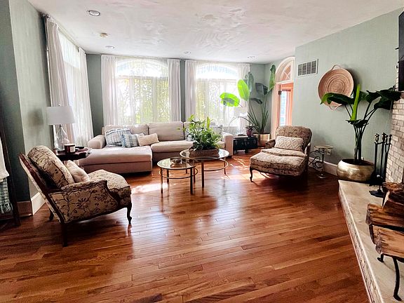 Family room off kitchen with fireplace.