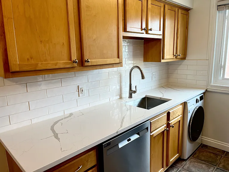 Kitchen updated in 2024 with new countertops, backsplash, sink, faucet...