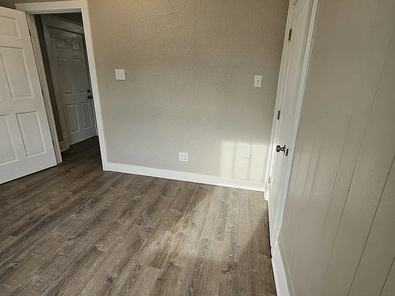 Front Bedroom 11' 6" x 10' with ceiling fan.