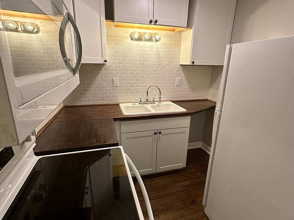 Brand new kitchen - new cabinets, appliance suite, butcher block counter tops, and subway tile backsplash. Tons of storage packed in a small space!