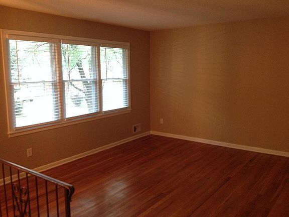 Living room with hardwood floors and big windows