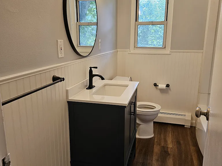 Newly remodeled bathroom.
Wainscoting, all new fixtures throughout and hickory plank flooring.