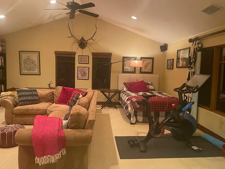 Family room/spare bedroom with larger closet, wet bar and giant Roku TV with PlayStation