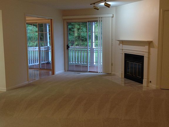 Living Room with gas fireplace!
Sliding glass doors to deck off living room and also, off dining room/den.