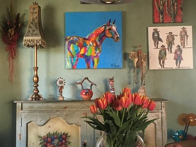 Authentic southwestern style and art in dining room area.