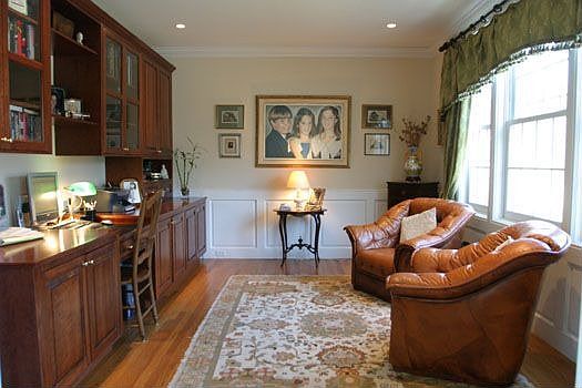 Library with custom cabinetry & wet bar