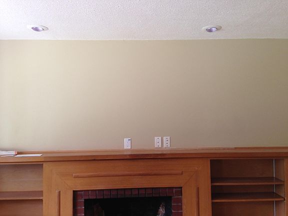 Fireplace and built in bookcase livingroom.