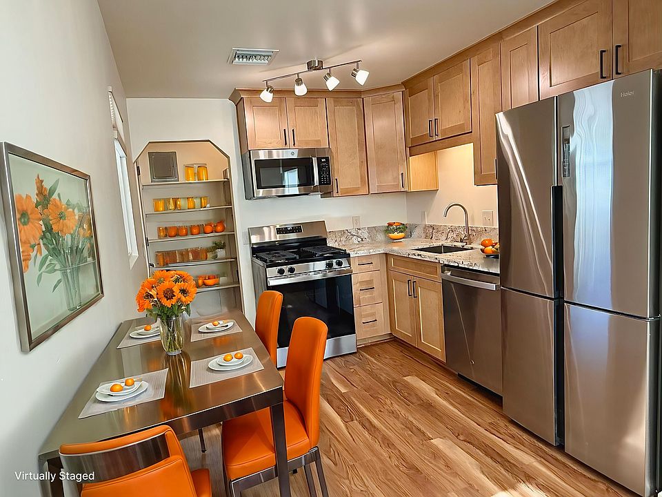 Newly renovated kitchen with new stainless steel kitchen cabinets, granite countertops, pantry, oversized extra deep stainless steel kitchen sink and high quality wood laminate flooring.