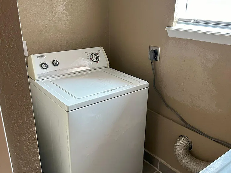 Washer in large laundry room
