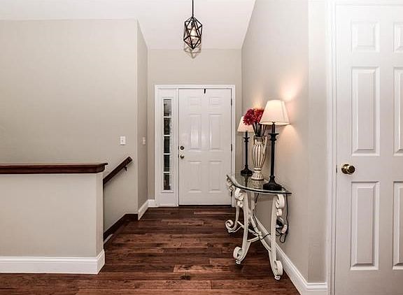 Fabulous entry hall welcomes you with beautiful hickory wood floors.