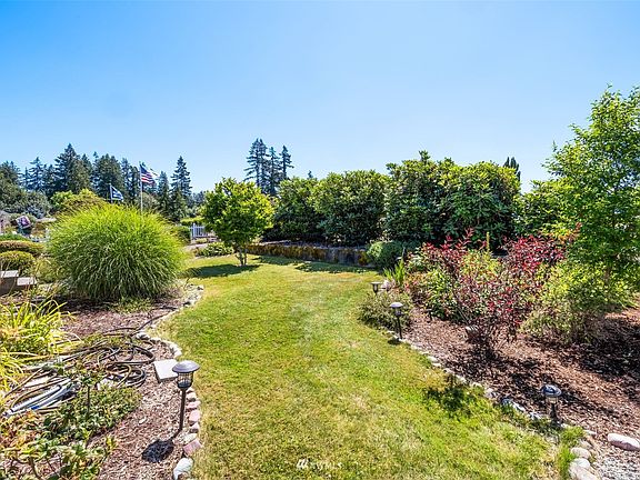 Gorgeous front yard! Lots of love is poured into this property! Mature landscaping. >