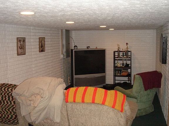Family-sized recreation room awaits in the basement for entertaining pleasure.