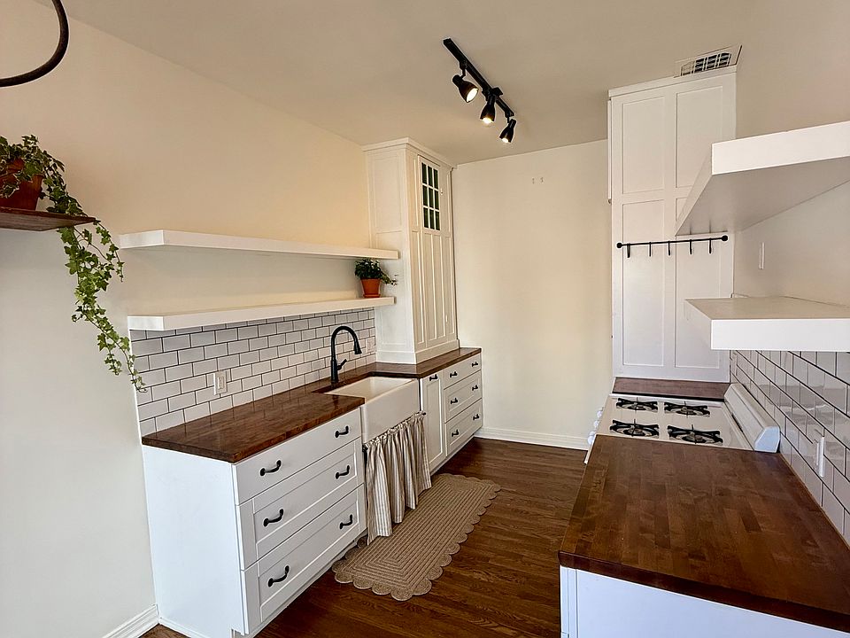 Charming Updated Kitchen with Bosch Refrigerator and Custom Cabinets