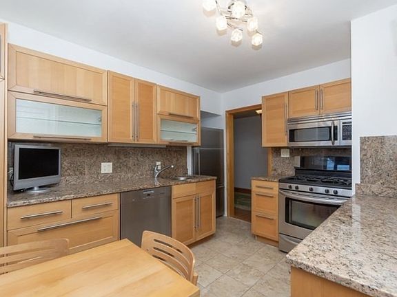 View of kitchen from back door (exit to porch and backstairs for parking/laundry)