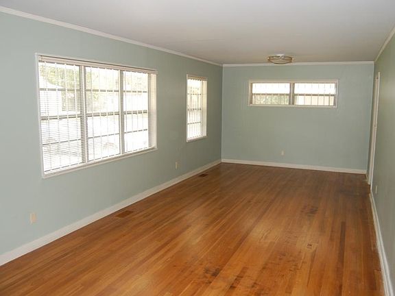 front door looking through living room to dining room area
