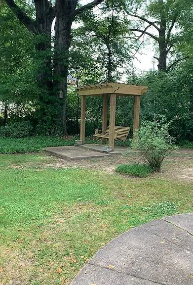 Porch swing and pergola in front yard