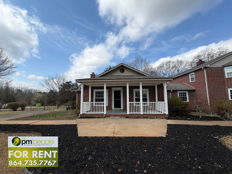 Enjoy a covered front porch, easy access to parking and garden beds that spring to life in warm weather!