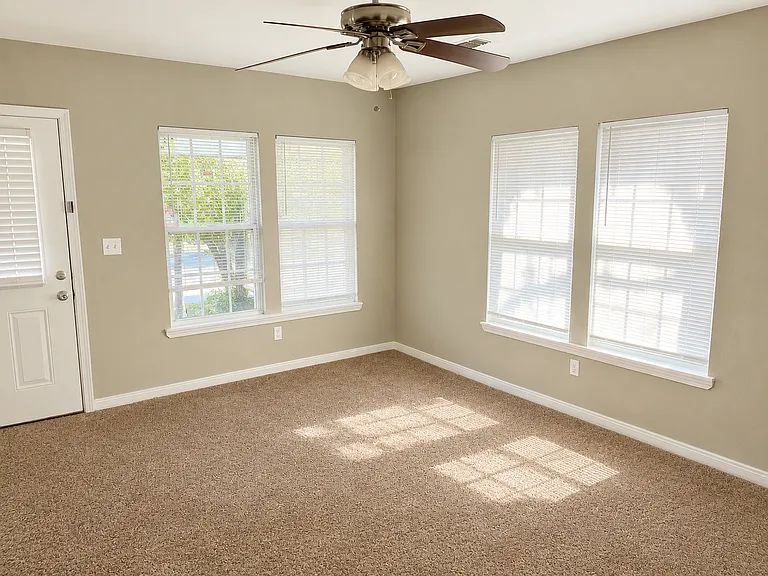 Welcoming Entry Living Area
As you enter the home, you're greeted by this bright and spacious shared living room featuring abundant natural light and plenty of room for relaxing, studying, or gathering with housemates.