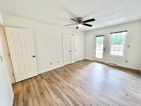 Primary Bedroom (Upstairs - Front with Balcony)