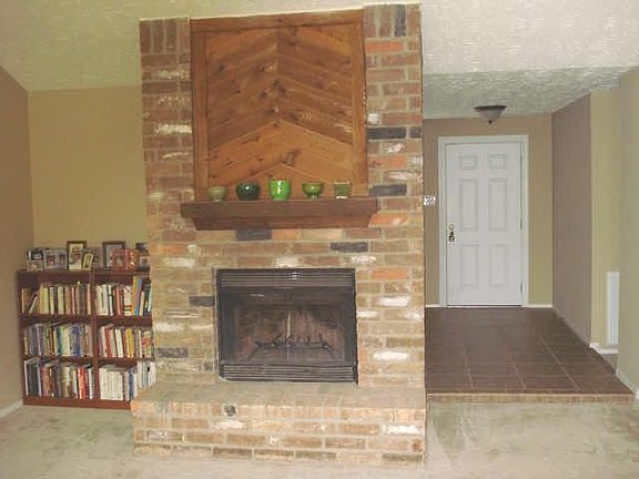 Fireplace - see the tiled entance behind it.