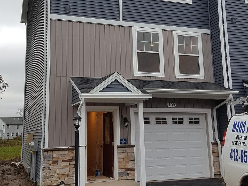 Front with single car garage; driveway is wide enough for two cars