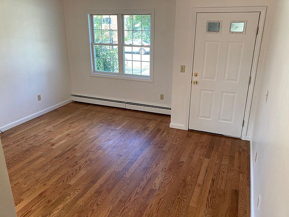 living room, view from stairs that lead to second floor