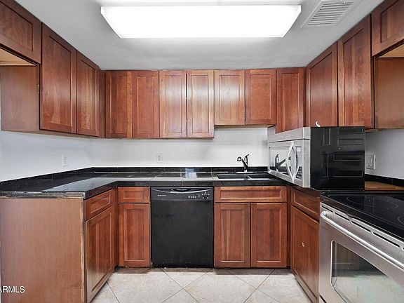 Kitchen, comes with Fridge, Microwave, stove, dishwasher, and garbage disposal. Granite counter tops.