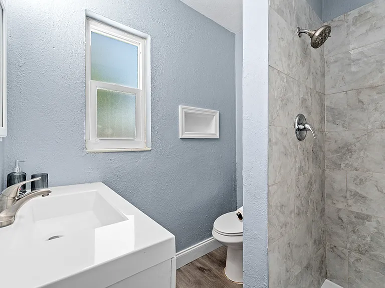 Large Bathroom Sink/Vanity, Built-In Shelves, & In-wall Mirror/Medicine Cabinet for extra storage/Stand-up shower with powerful shower head and built-in wall shelves