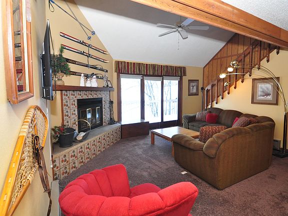 spacious living room with new smart tv and working fireplace