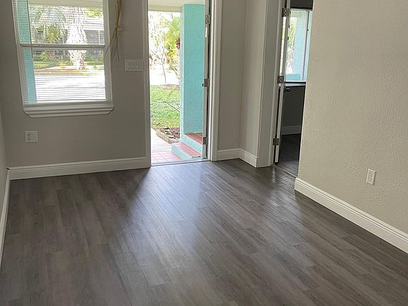 Living room area looking at front door