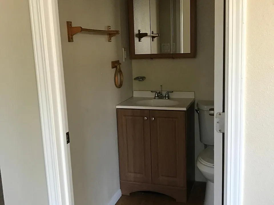 Cute small bathroom with Shower and Tub.