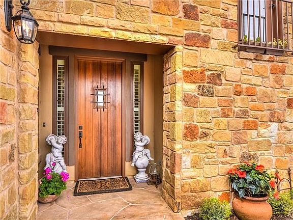 Wood front door with speakeasy window to visit with anyone coming to porch.