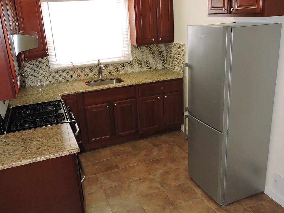 Kitchen with granite countertop and stainless steel applianc