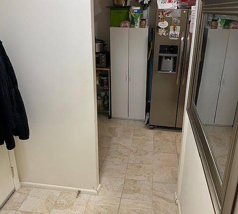 Kitchen adjacent to foyer