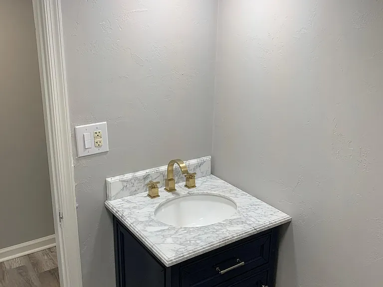 Basement Full Bathroom (there is now a mirror hanging over this vanity)