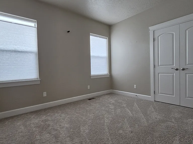 BEDROOM #1 WITH DOUBLE DOOR CLOSET.