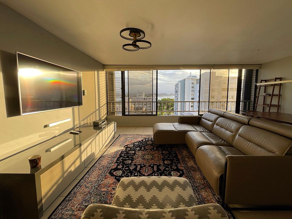 Living room with 5.1 Bose Sound System and Electric Recliner Sofa