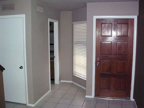 Inside of door with 1/2 bath on the left