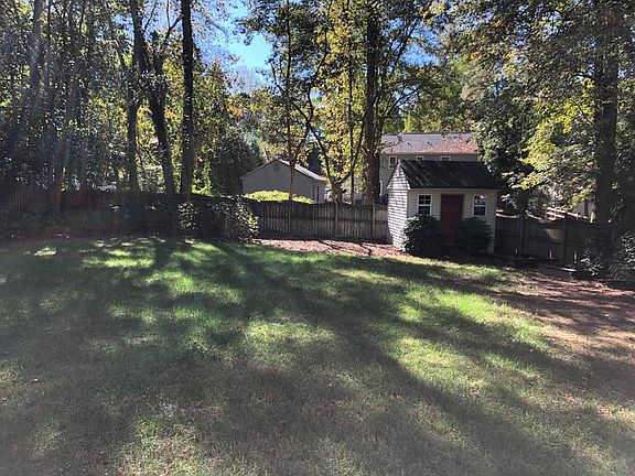 FENCED PRIVATE BACK YARD WITH STORAGE BUILDING